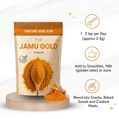 A stand-up pouch of Jamu Gold herbal powder displayed on a wooden pedestal, with orange text callouts on the right explaining daily dosage and usage suggestions. The pouch features a natural beige background with a large spoonful of golden-yellow powder and a small turmeric root illustration.