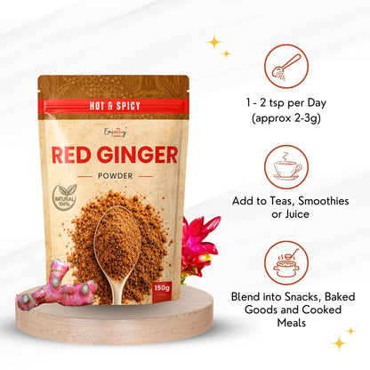 A stand-up pouch of Red Ginger Powder displayed on a round wooden pedestal, with three circular usage callouts on the right and a small ginger root and flower prop at the base. The package is beige with red and brown accents and shows a spoonful of brown powder.